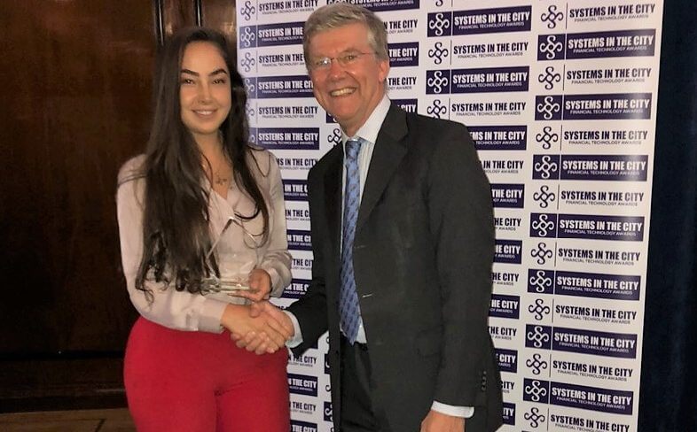 Wealth Dynamix employee shown accepting award after the company were named double winners at the Goodacre Systems in the City Awards