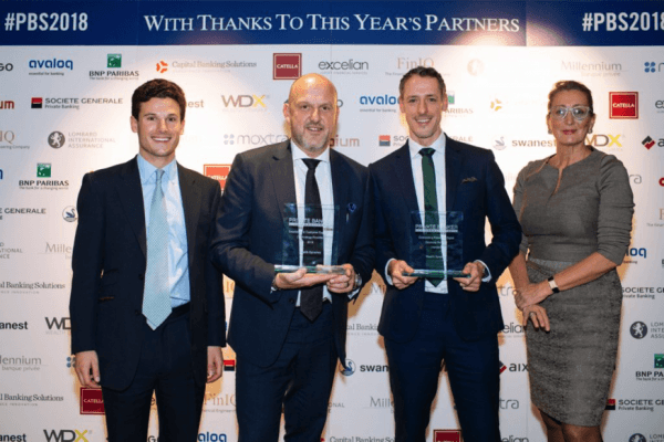 Wealth Dynamix employees shown holding awards after winning double at the Private Banker International Swiss Awards