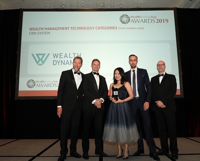 Wealth Dynamix Team collecting award for WealthBriefingAsia Awards 2019